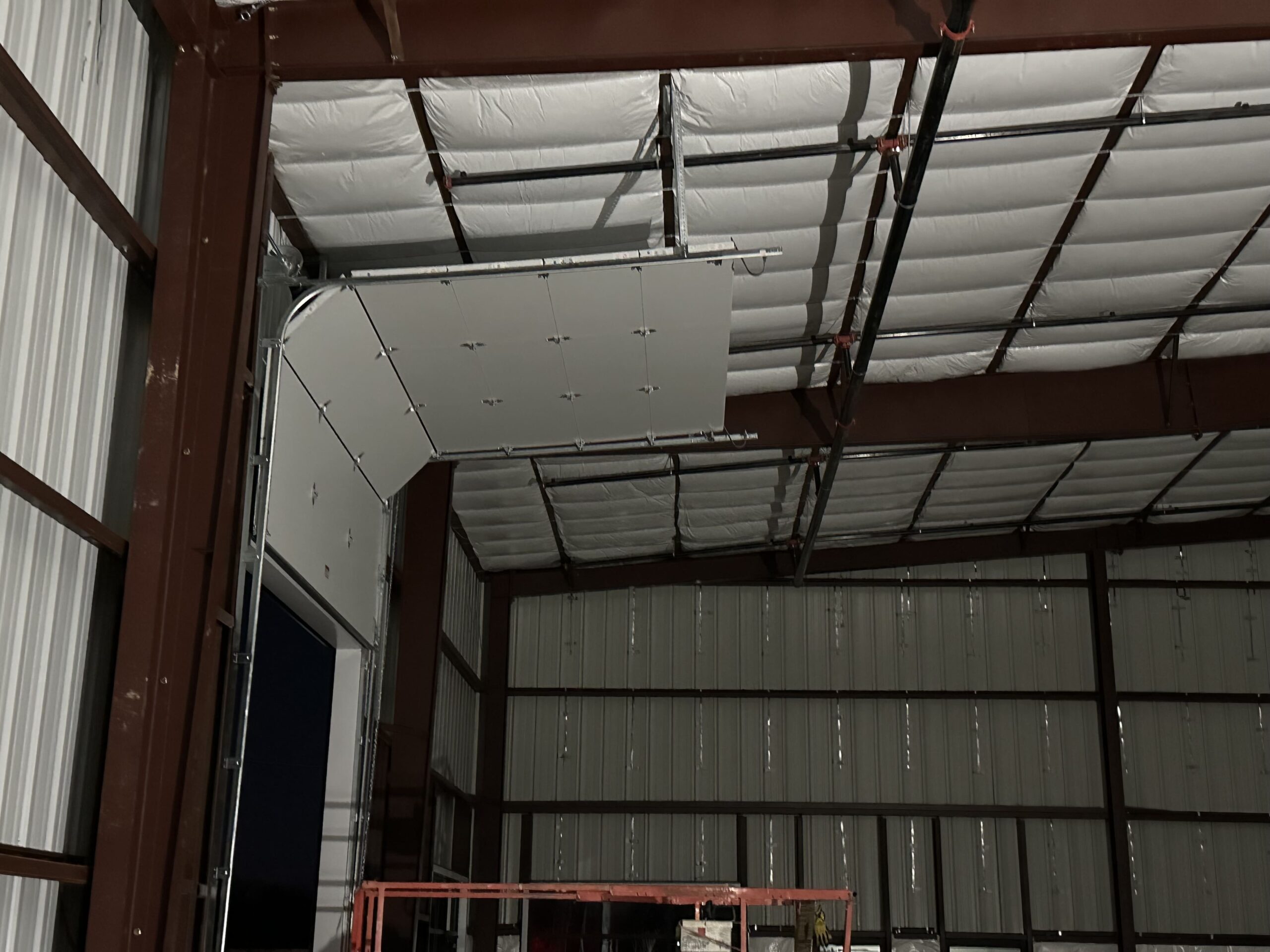 warehouse-overhead-door1 sideview high lift overhead door